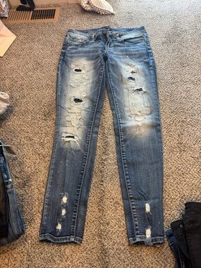 Buckle black skinny jeans